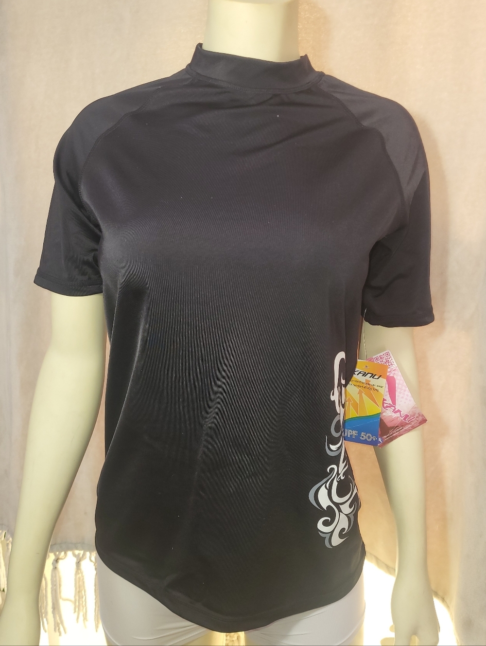 Kanu Surf Black Short-Sleeve Swim Tee Size Medium with White Side Scroll